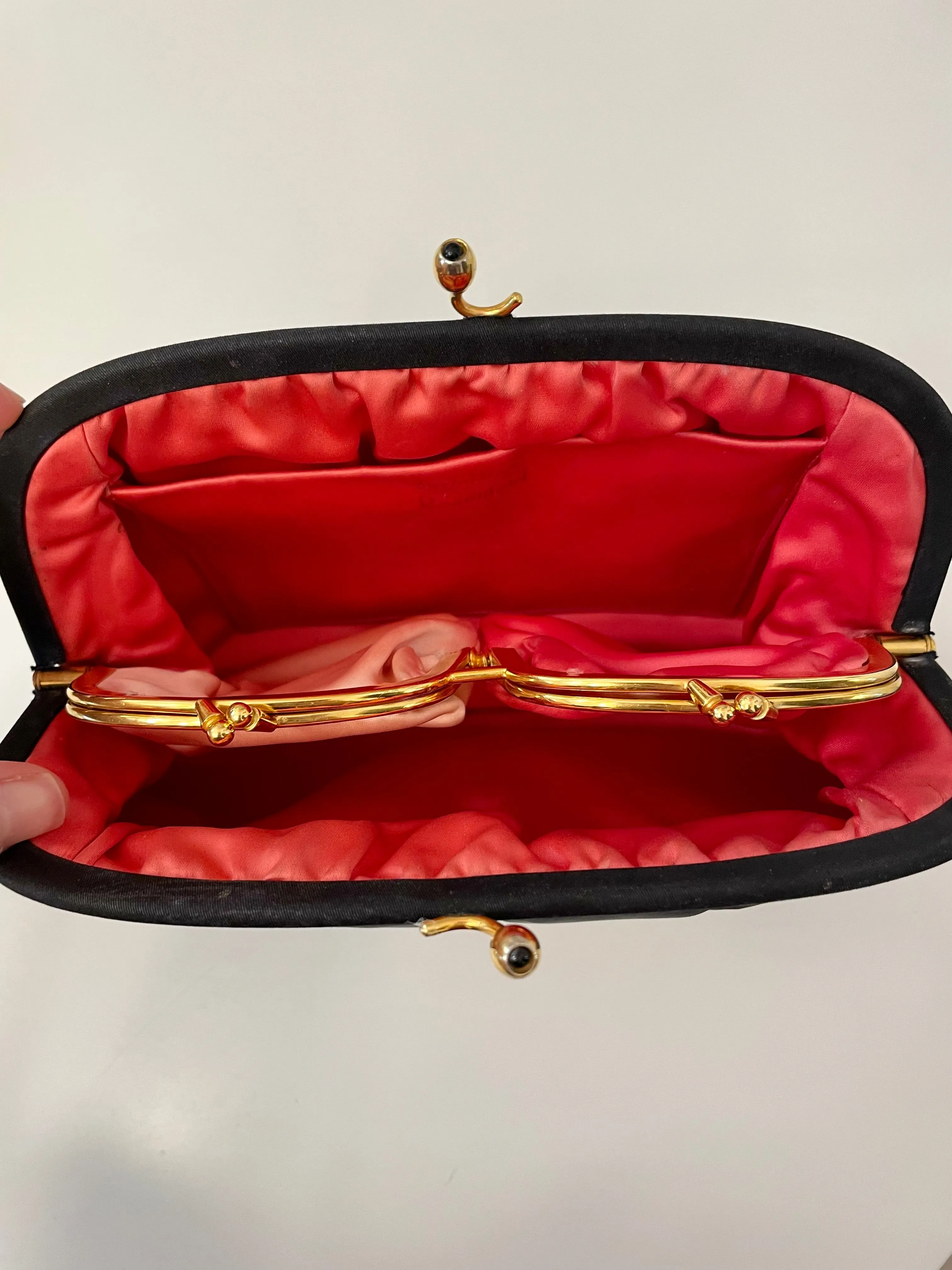 The Socialite and her love of the classic noir satin evening bag... this one is absolutely elegant!
