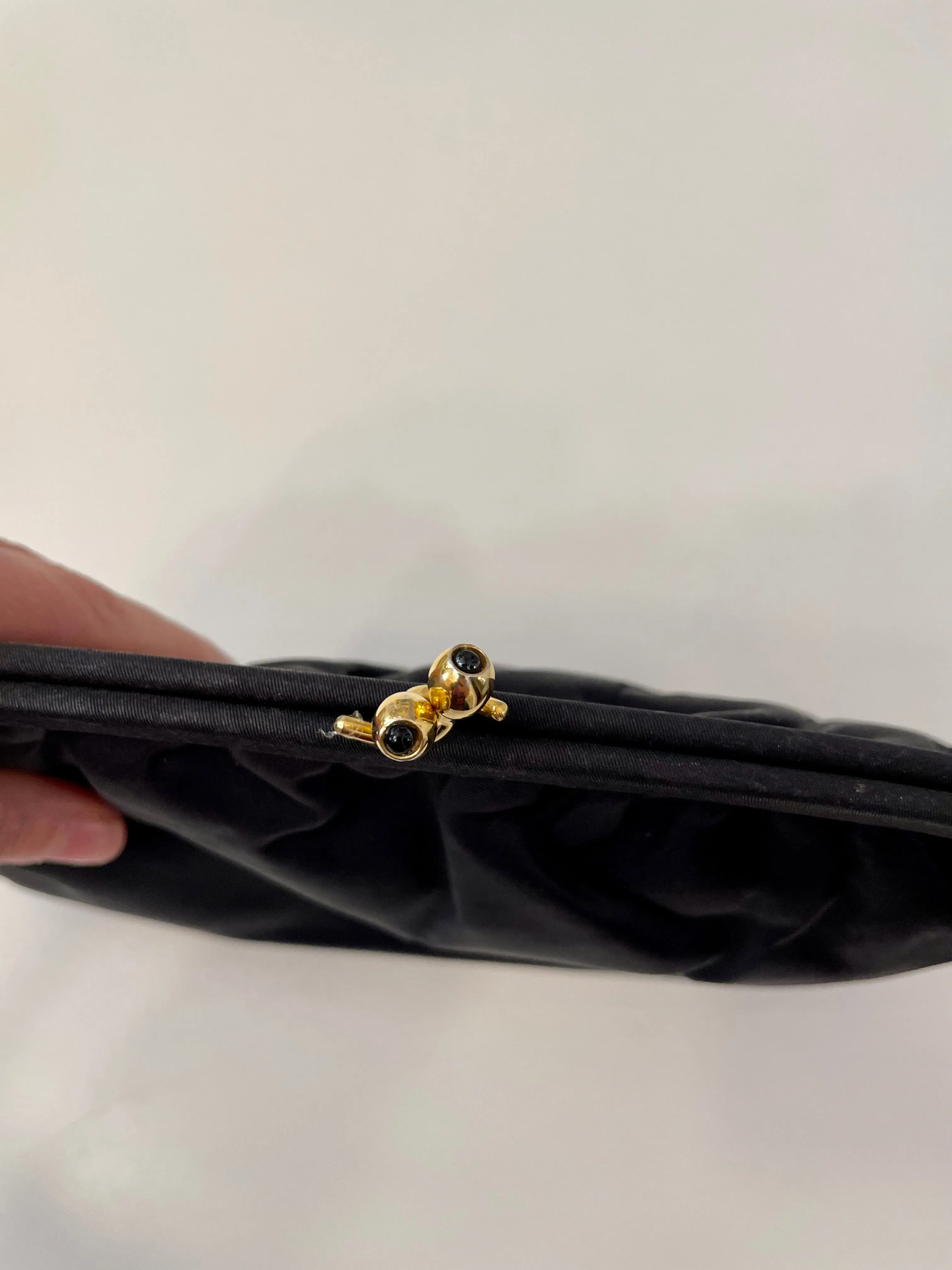 The Socialite and her love of the classic noir satin evening bag... this one is absolutely elegant!